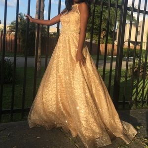 A glittery gold sequin A Line prom dress